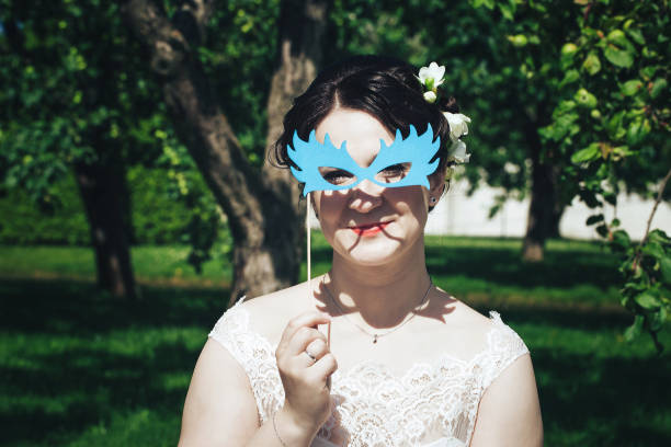 istock Bride on a Wedding Walk in the Park 872353082