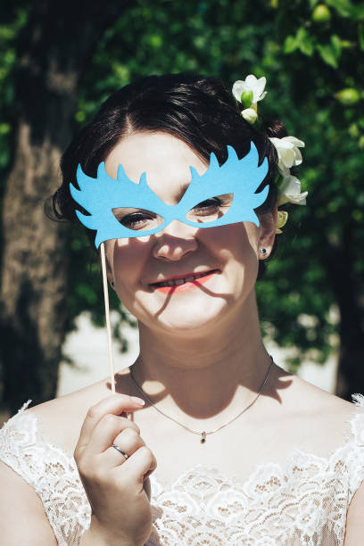 istock Bride on a Wedding Walk in the Park 872353114