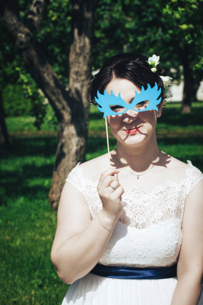 istock Bride on a Wedding Walk in the Park 872353124