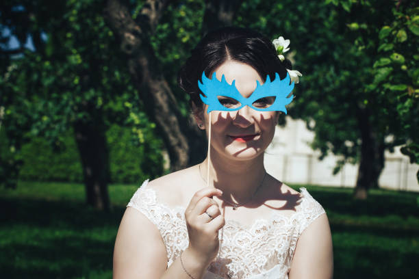 istock Bride on a Wedding Walk in the Park 872353188