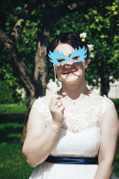 istock Bride on a Wedding Walk in the Park 872355526