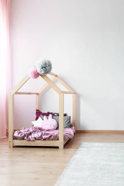 istock Wooden bed in child's bedroom 872361156