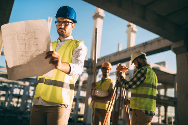 istock Portrait of construction engineers working on building site 872368040