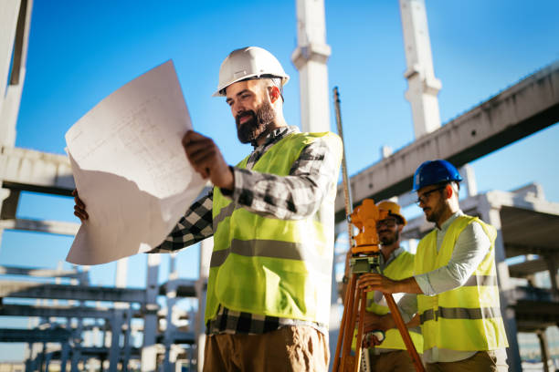 istock Portrait of construction engineers working on building site 872368222