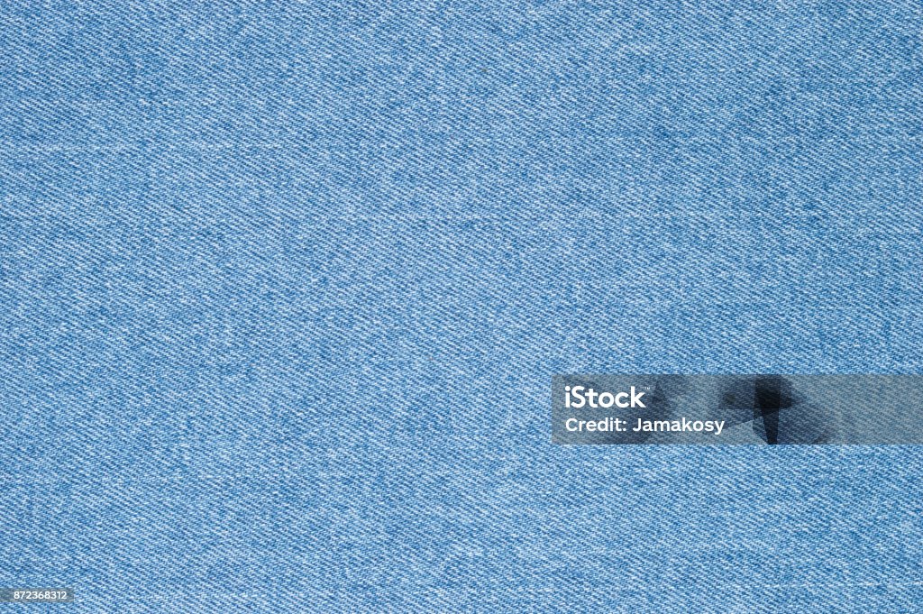 Natural blue jeans texture background. Denim Stock Photo