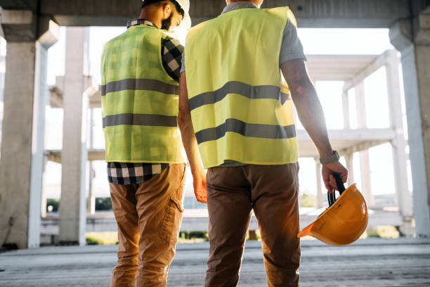 istock Portrait of construction engineers working on building site 872368402