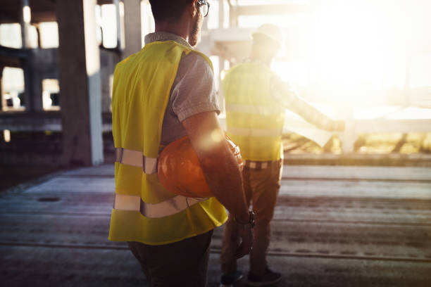 istock Portrait of construction engineers working on building site 872368498
