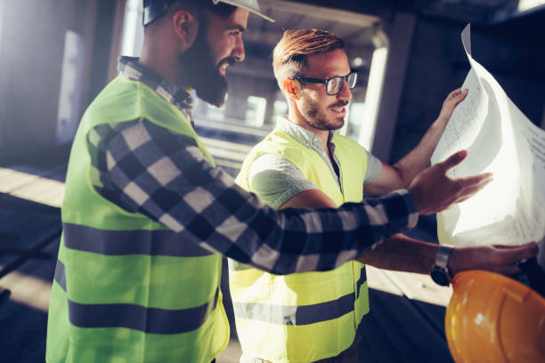 istock Portrait of construction engineers working on building site 872368734