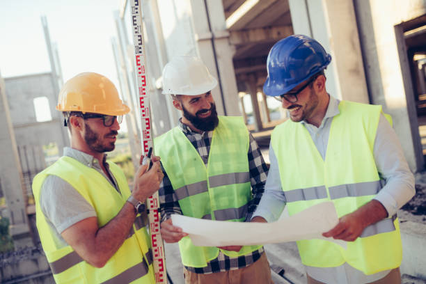 istock Portrait of construction engineers working on building site 872368834