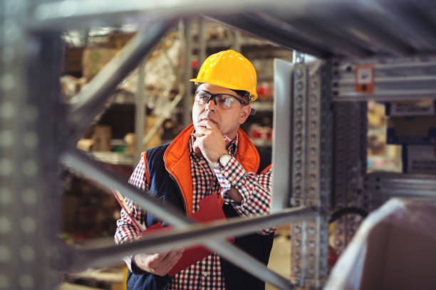 istock Foremen taking inventory in company warehouse 872369176