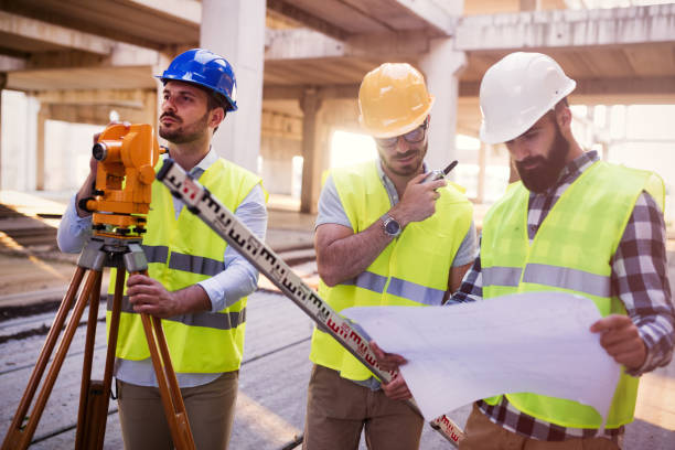 istock Portrait of construction engineers working on building site 872369330