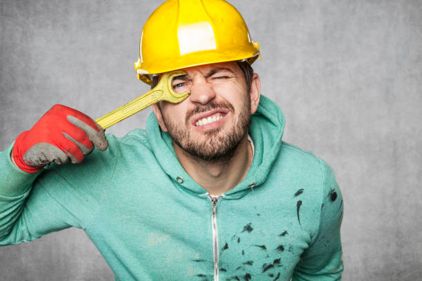 A smiling worker puts a key to the eye
