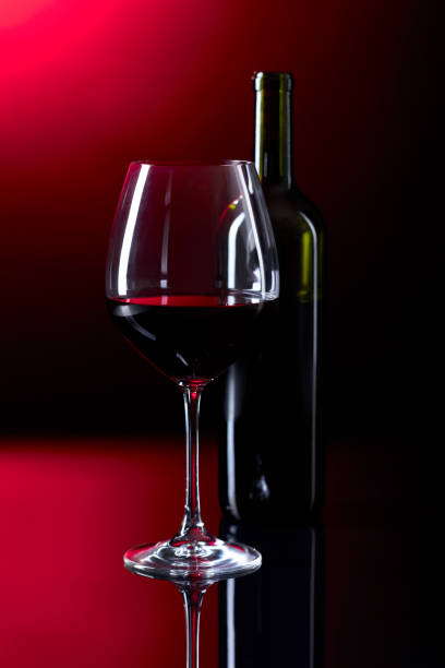 istock Glass and bottle of red wine. 872374062