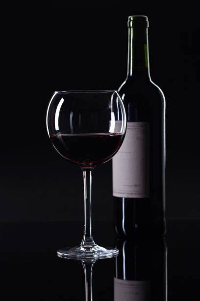 istock Bottle and glass of red wine . 872374150