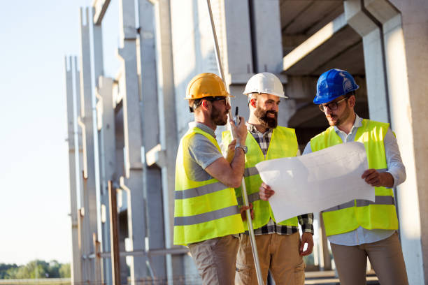 istock Portrait of construction engineers working on building site 872374634