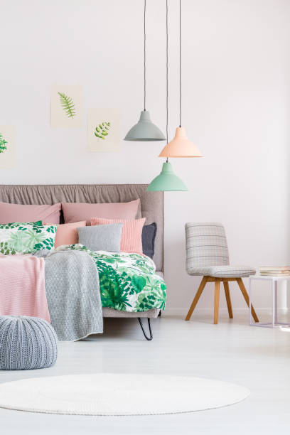 istock Grey chair in colourful bedroom 872375696