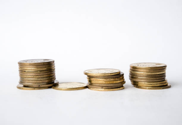 istock Stacks of coins against white background. Saving money concept. 872377954
