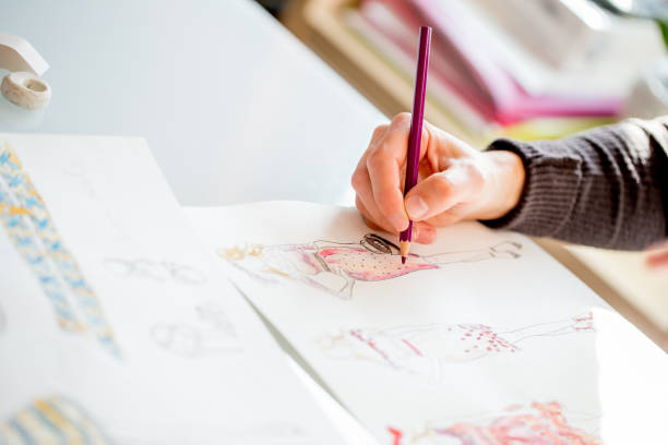 istock Fashion Designer Hand Drawing Sketches 872378254