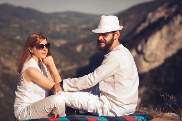 istock Young couple on top of a mountain 872382826