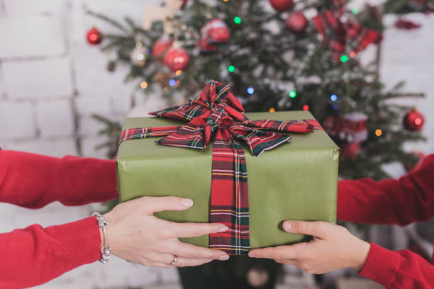 istock Gifts and presents in hands 872385526