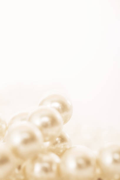 istock Pile of pearls on the white background 872386378