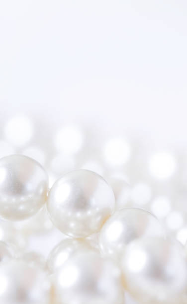 istock Pile of pearls on the white background 872386428