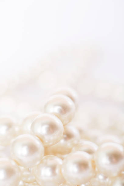 istock Pile of pearls on the white background 872386636