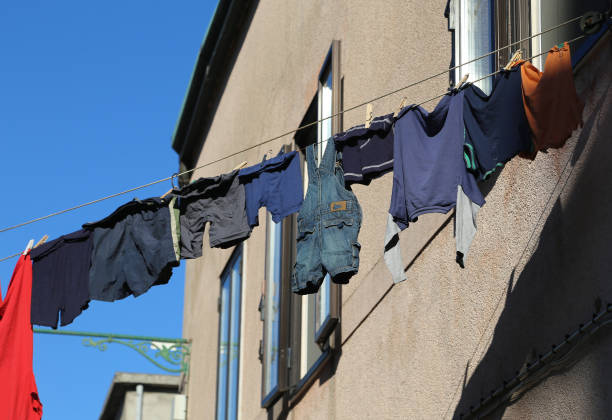 istock clothes hanging out in the alley 872389106