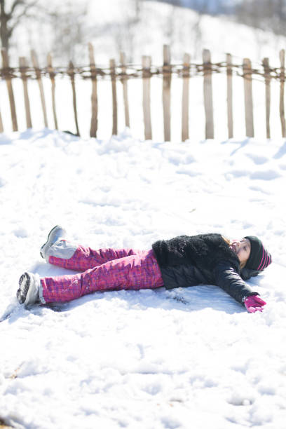 istock Kids having fun in winter . 872389648