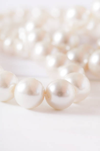 istock Pile of pearls on the white background 872389794