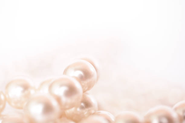 istock Pile of pearls on the white background 872390064