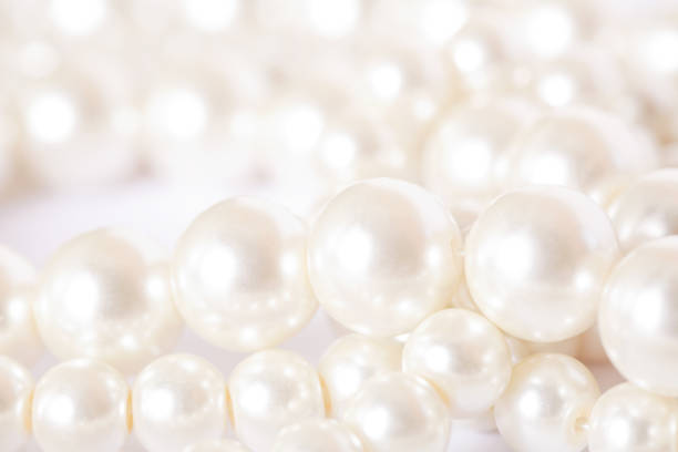 istock Pile of pearls on the white background 872394240