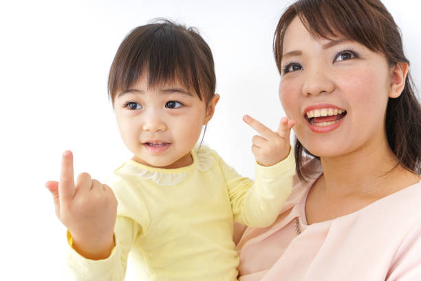 istock Mother carrying the child in her arms 872394254
