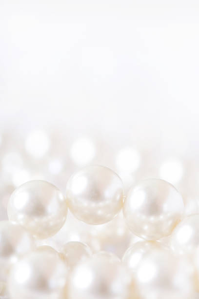 istock Pile of pearls on the white background 872397486