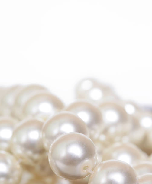 istock Pile of pearls on the white background 872397502