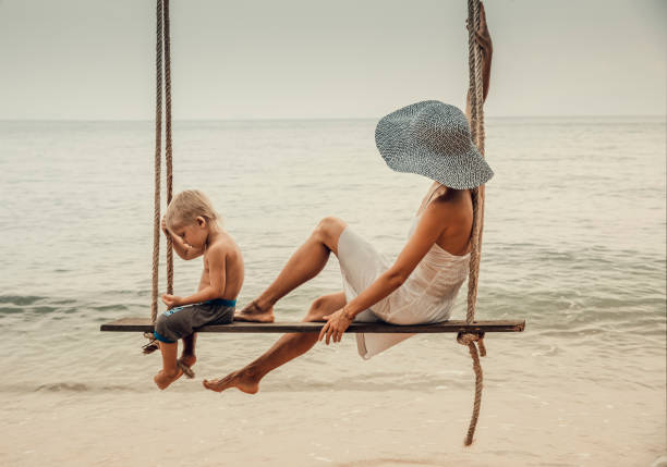 Family having fun at tropical swing