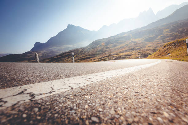 istock winding road mountain pass san bernardino, switzerland 872402098