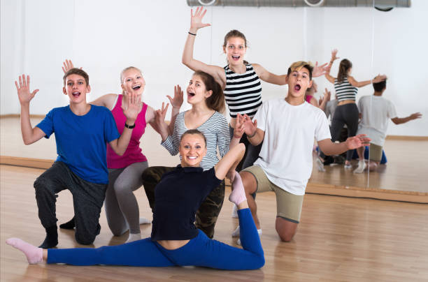istock Happy teen with teacher in dance studio smiling 872406066