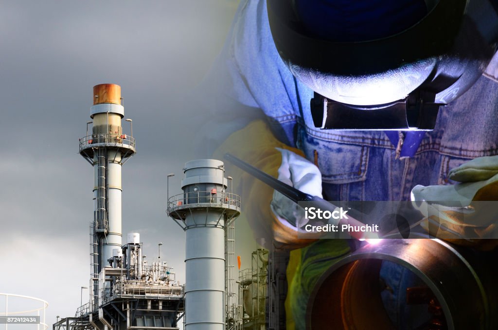 The abstract scene of welding operator with the factory background. The abstract scene of welding operator with the factory background.Construction industrial concept. Industry Stock Photo