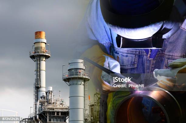 The Abstract Scene Of Welding Operator With The Factory Background Stock Photo - Download Image Now
