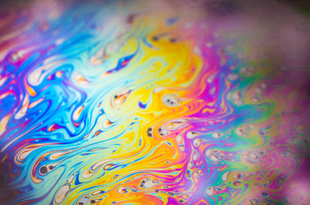 istock Beautiful psychedelic abstraction formed by light on the surface of a soap bubble 872419360