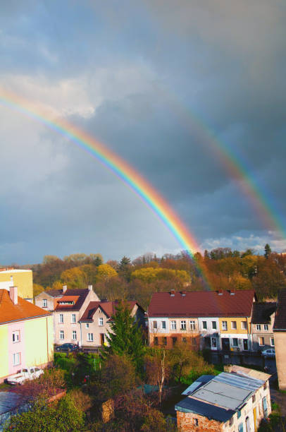 istock Rainbow over the city in autumn 872421500