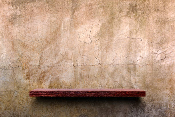 istock Wooden shelf on the gray stone wall. 872425104