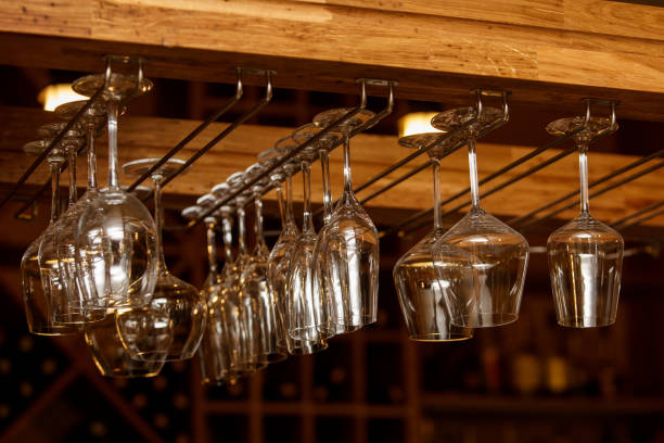 istock Empty glasses for wine above a bar rack in vintage tone 872430002