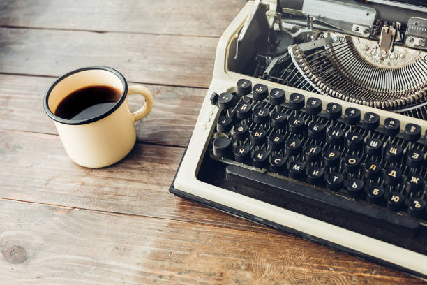 istock Typewriter And A Mug Of Hot Coffee On A Wooden Table 872441176