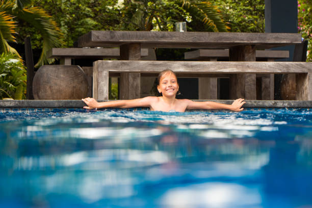 istock Enjoying in swimming pool 872441242