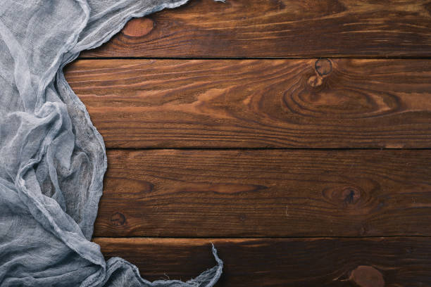 istock Lining fabric on a wooden background. Top view. Free space for your text. 872441750