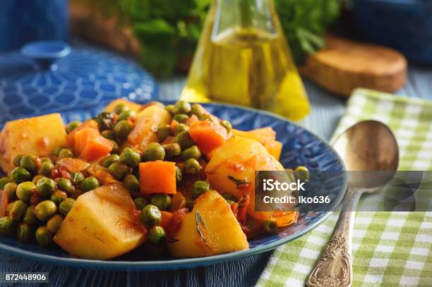 Vegetarian Food Potatoes With Pea And Tomatoes Greek Style Cuisine Stock Photo - Download Image Now