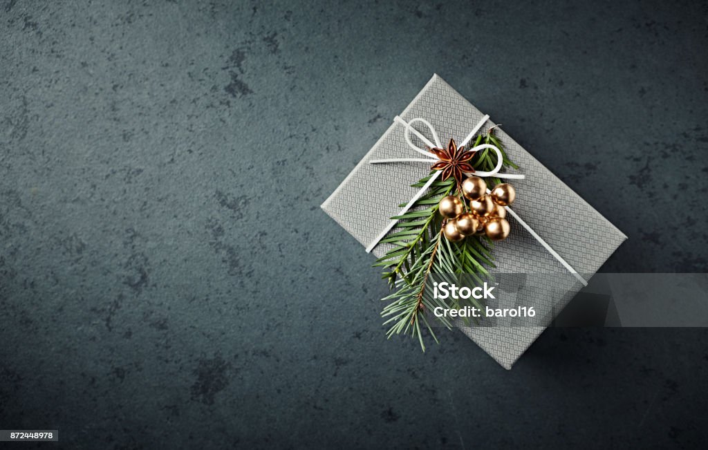 Christmas present decorated with yew twigs and anise Anise Stock Photo