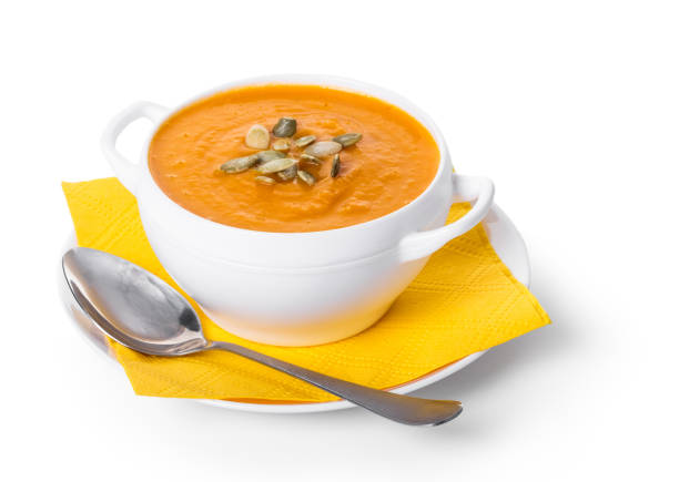 organic pumpkin cream soup on a white isolated background